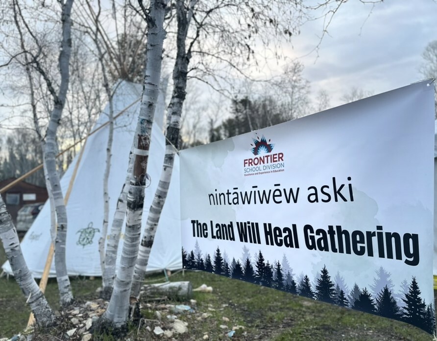 image with birch trees, a tipi and banner that reads 'The Land Will Heal Gathering'
